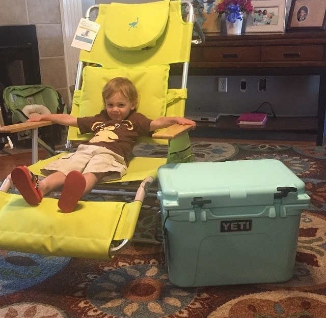 kid enjoying chair and yeti cooler