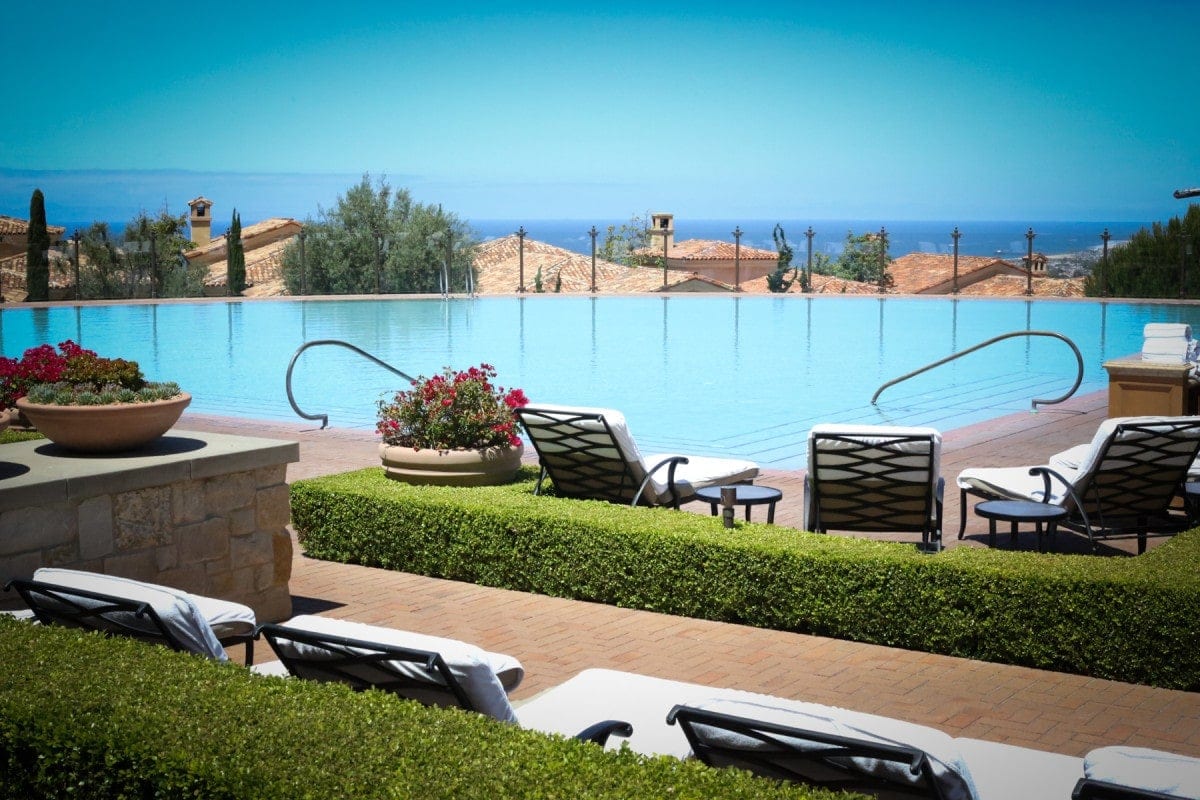 trips while pregnant view of pelican hill pool, one of the top babymoon destinations