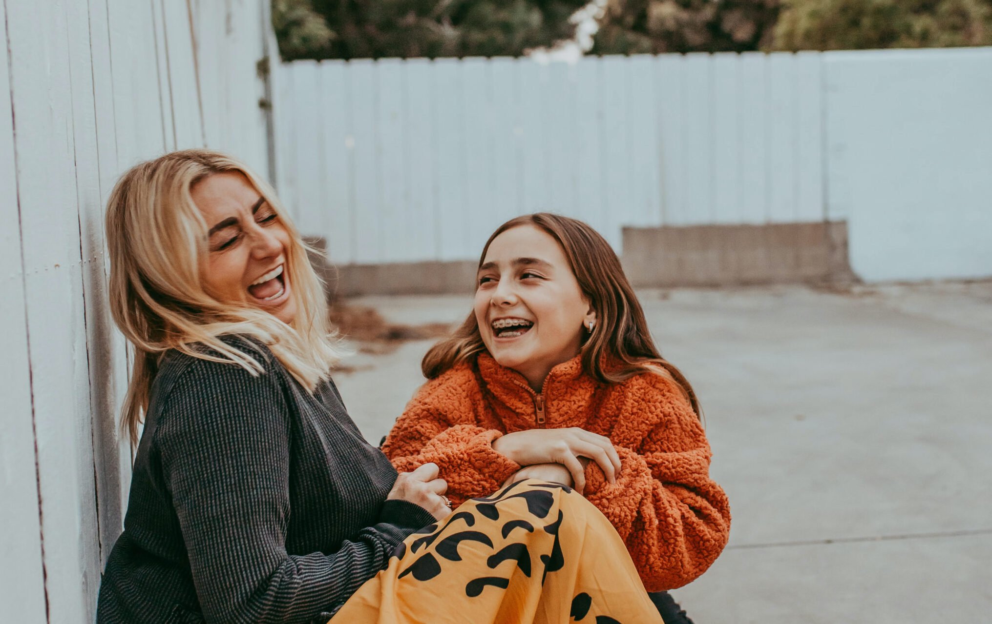 mom and daughter laughing