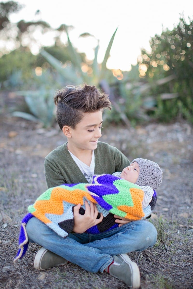 boy holding baby brother