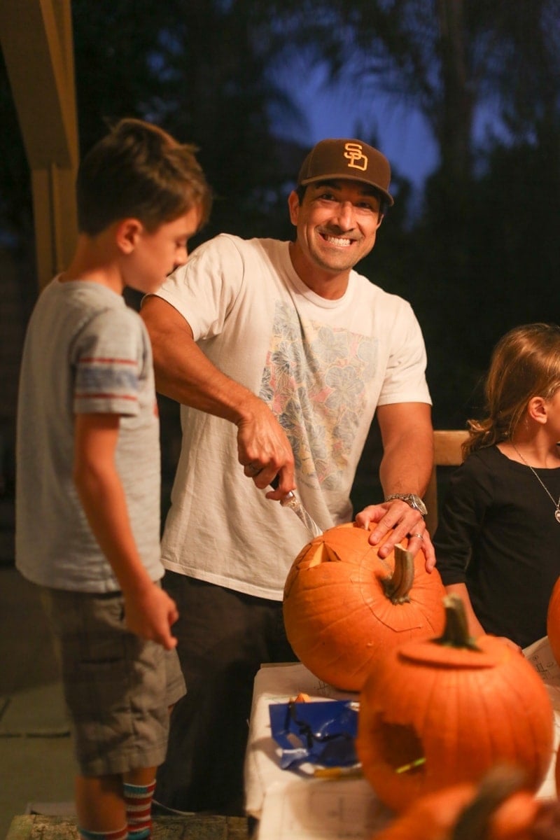 dad and son carving pumpkin