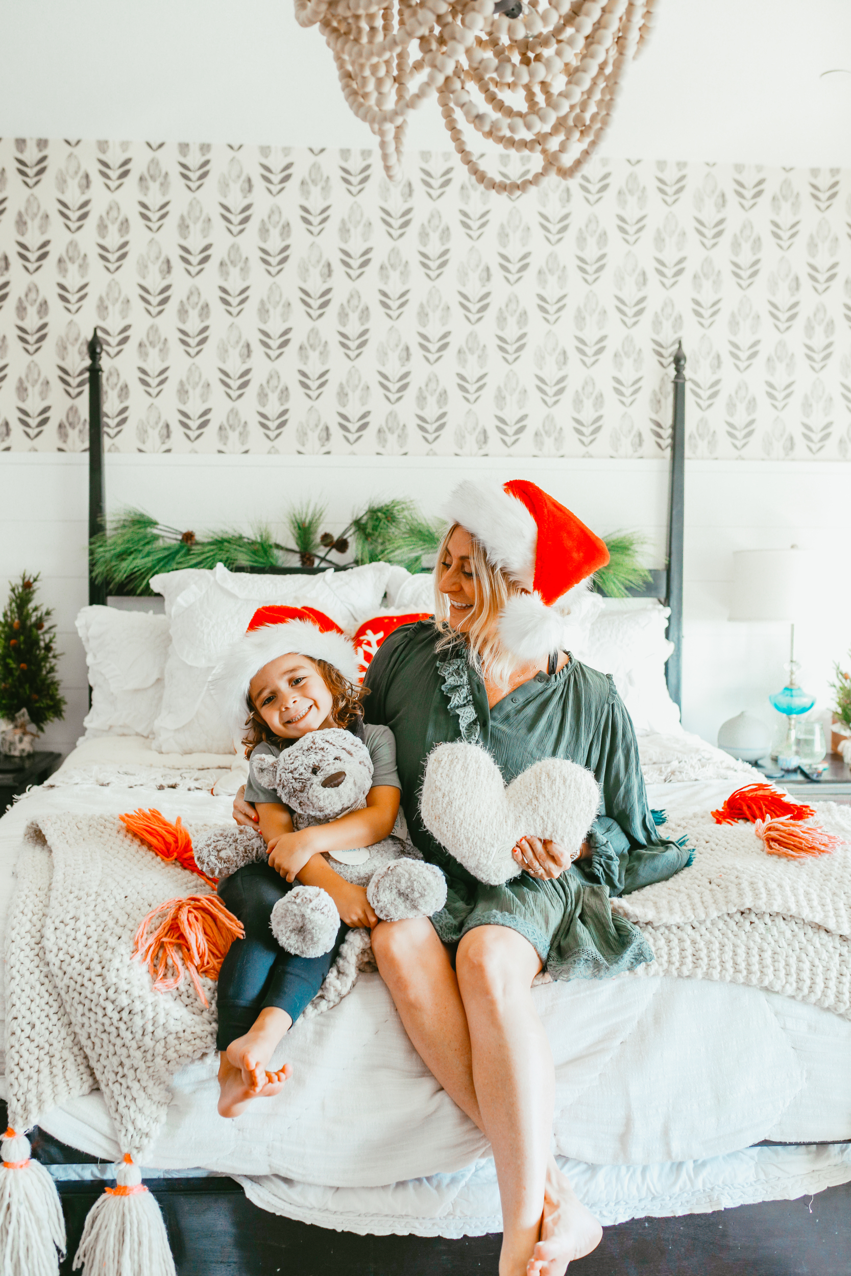 mom and toddler on bed during holidays