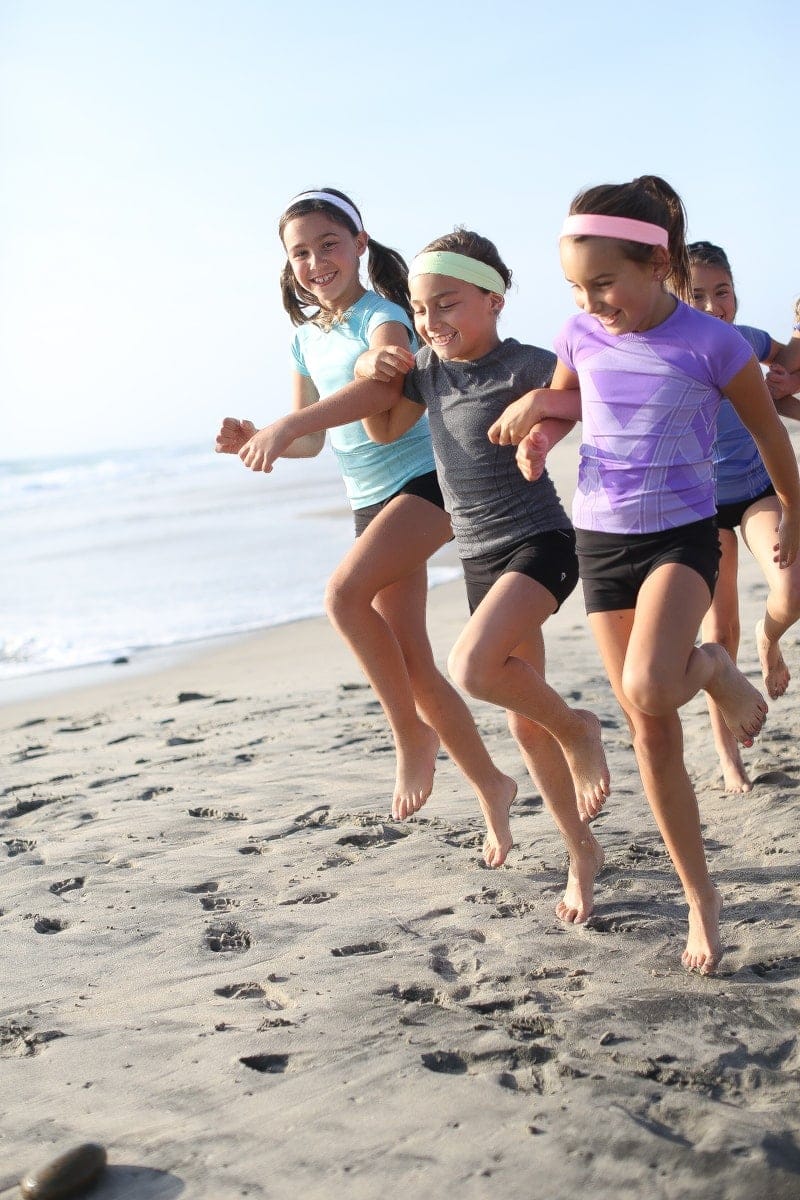 girls running on beach
