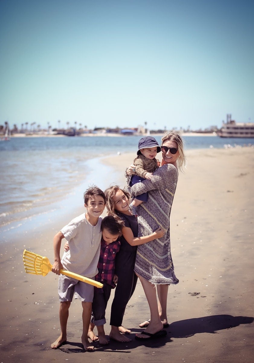 mom at beach with children