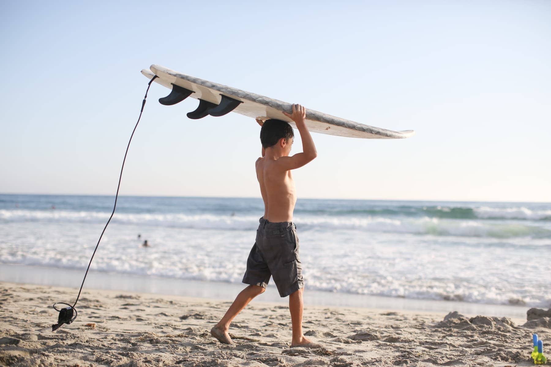 boy with surfboard