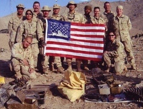 military holding american flag