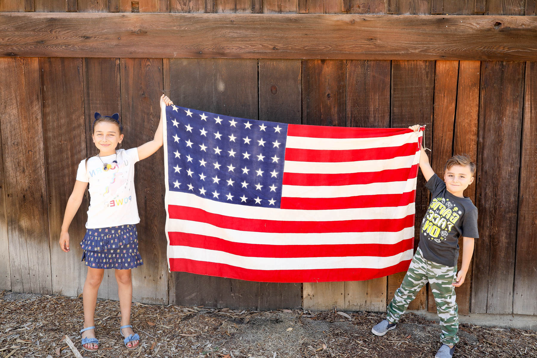 kids holding an american flag