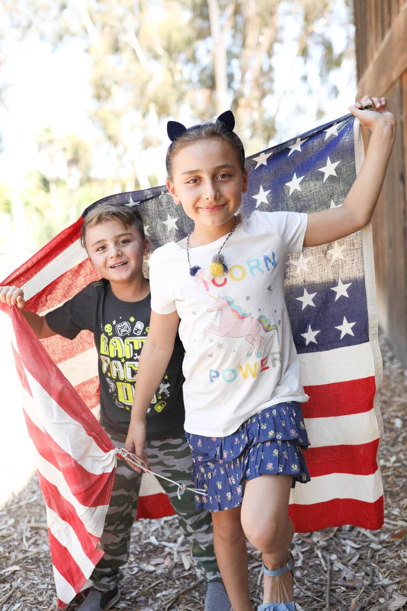 kids playing with american flag