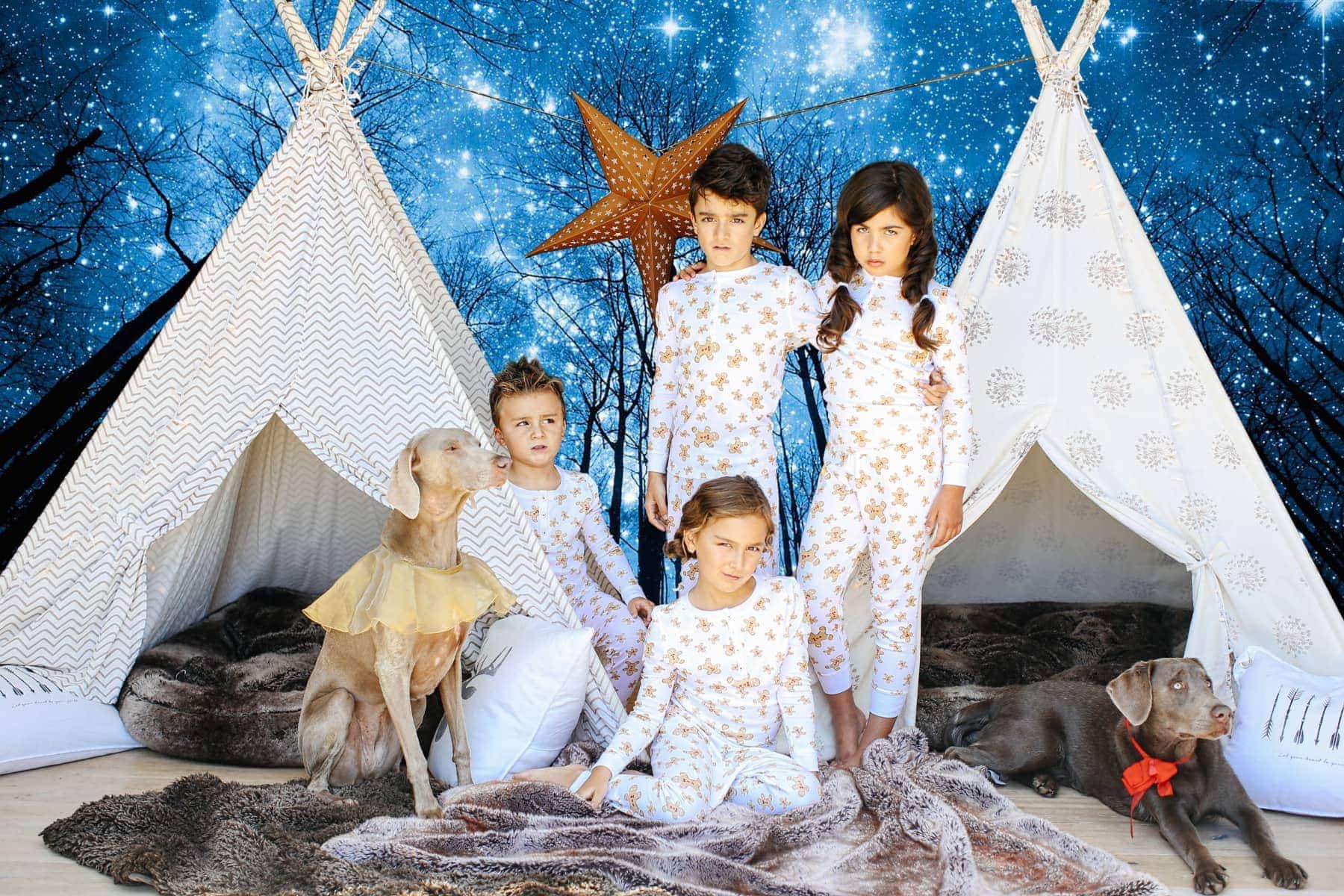 kids and dog in pajamas with teepees and night sky