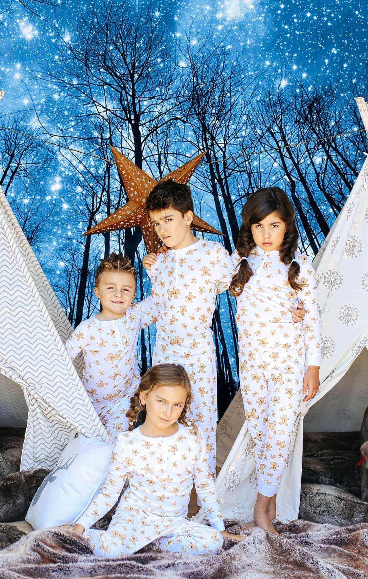 kids in pajamas with night sky