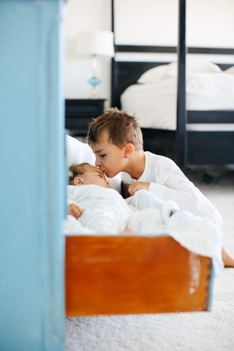 boy kissing baby brother