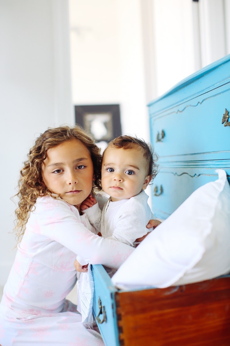 girl and baby looking at camera