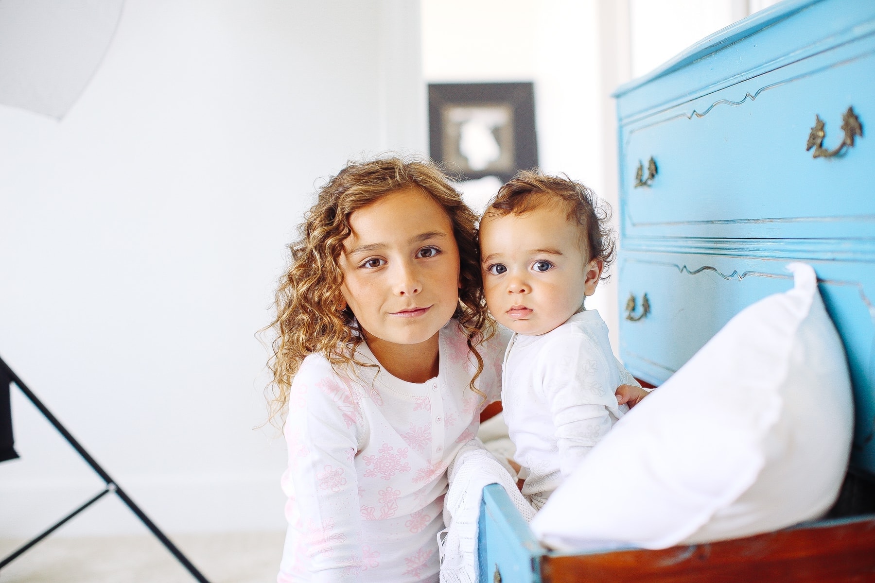 girl and baby looking at camera