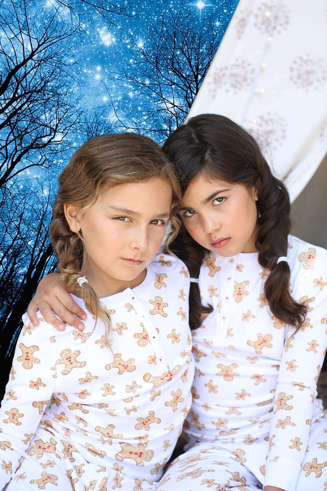girls in matching christmas pajamas