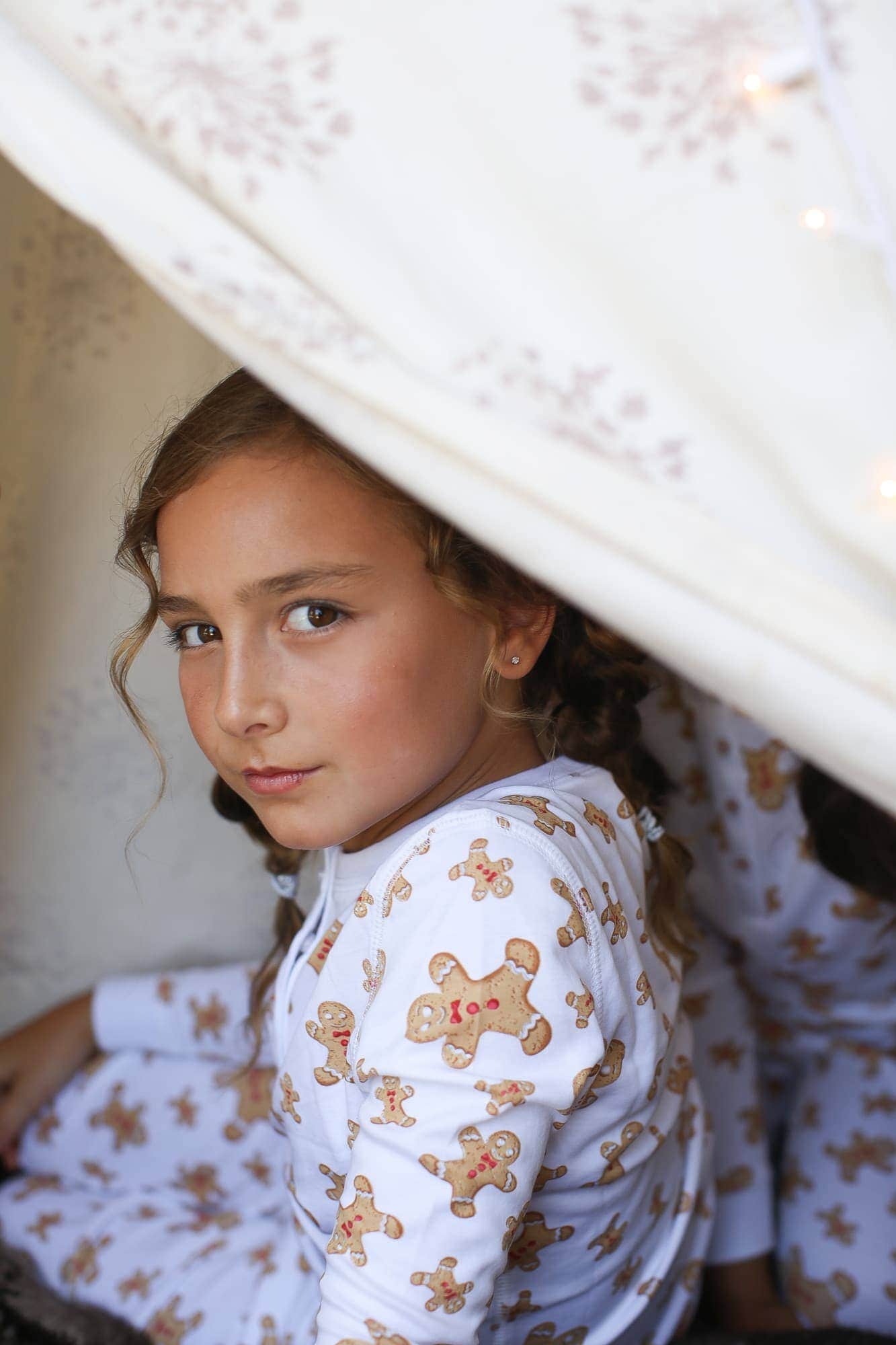 girl in gingerbread pajamas