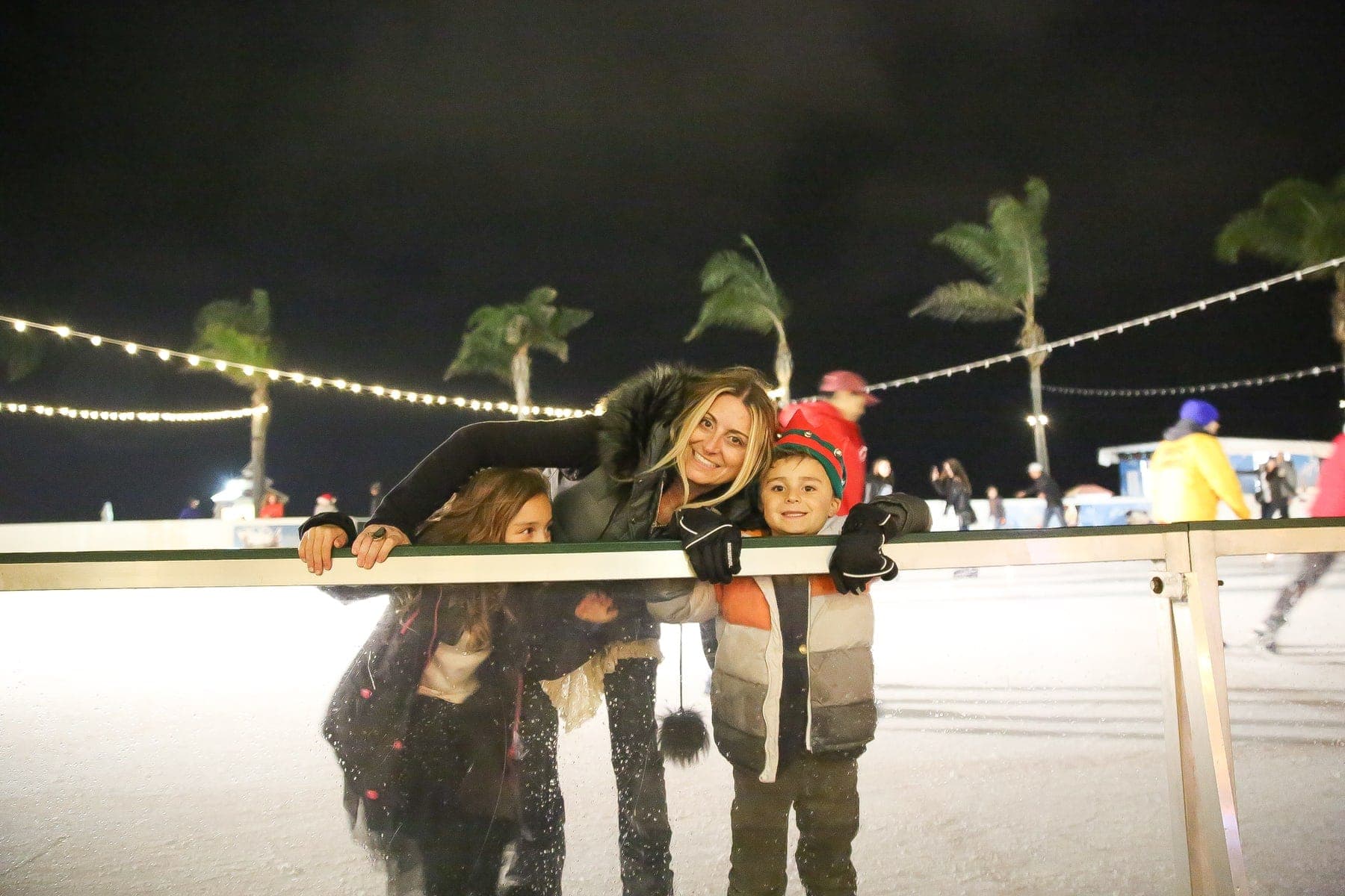 mother and children ice skating