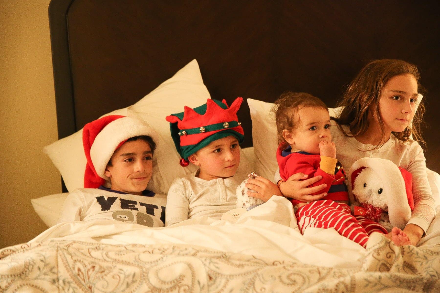 kids in bed on christmas