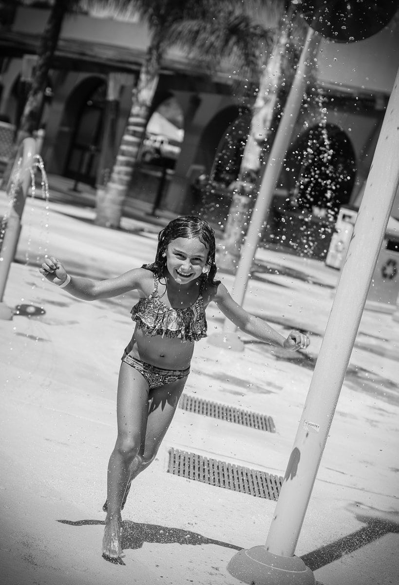 girl playing in water 