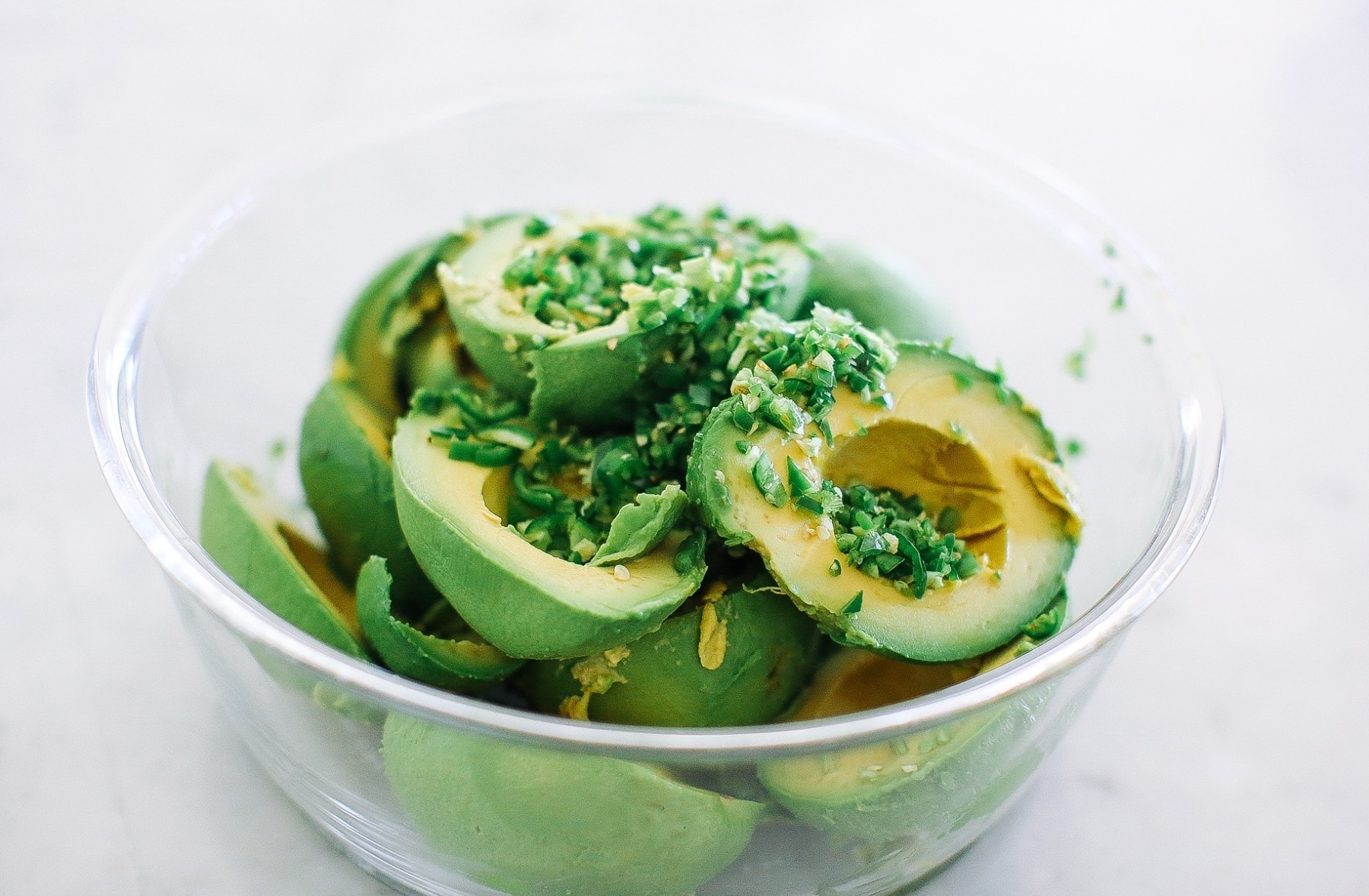 avocados with chilis in a bowl