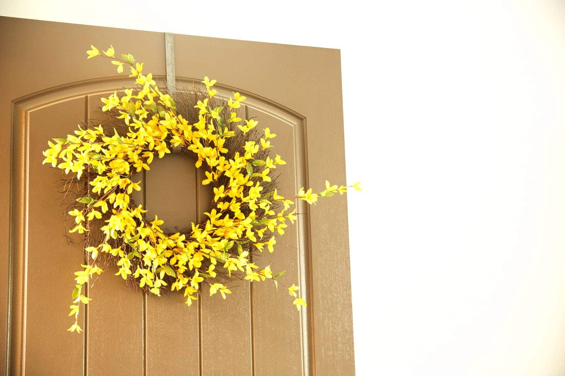 yellow flowers in door wreath