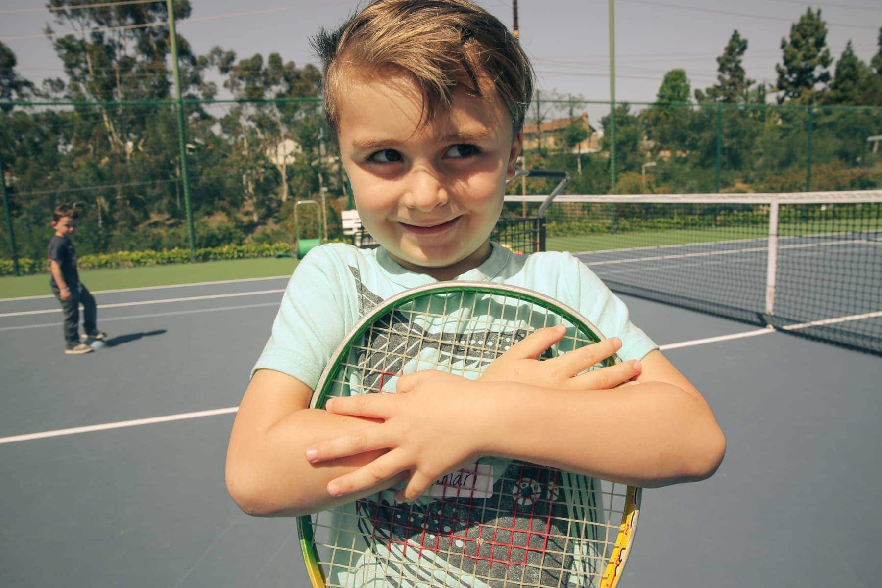 boy playing tennis 