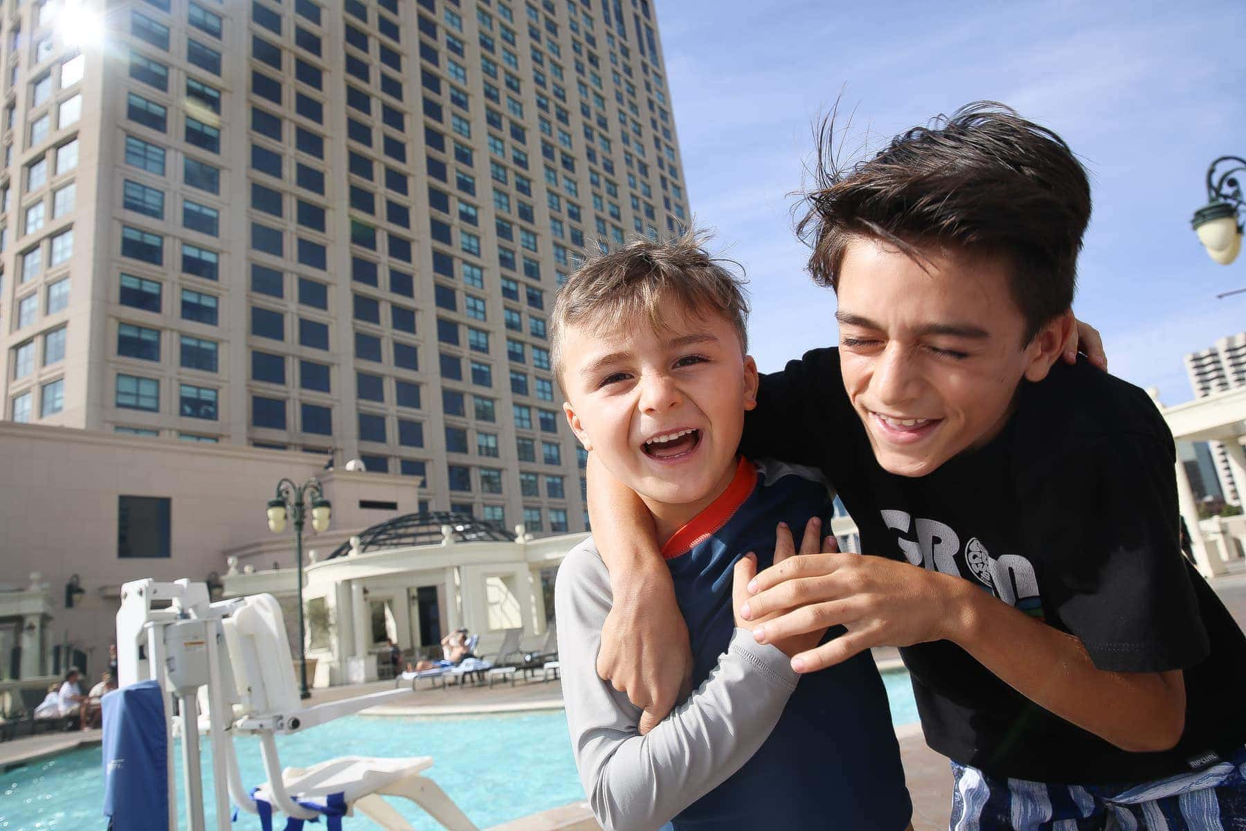 brothers playing by the Manchester Grand Hyatt San Diego pool