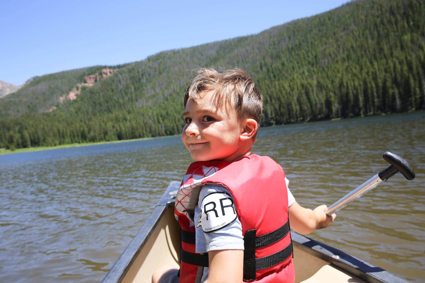 boy on canoe