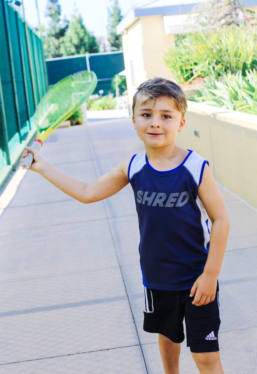 boy playing tennis 