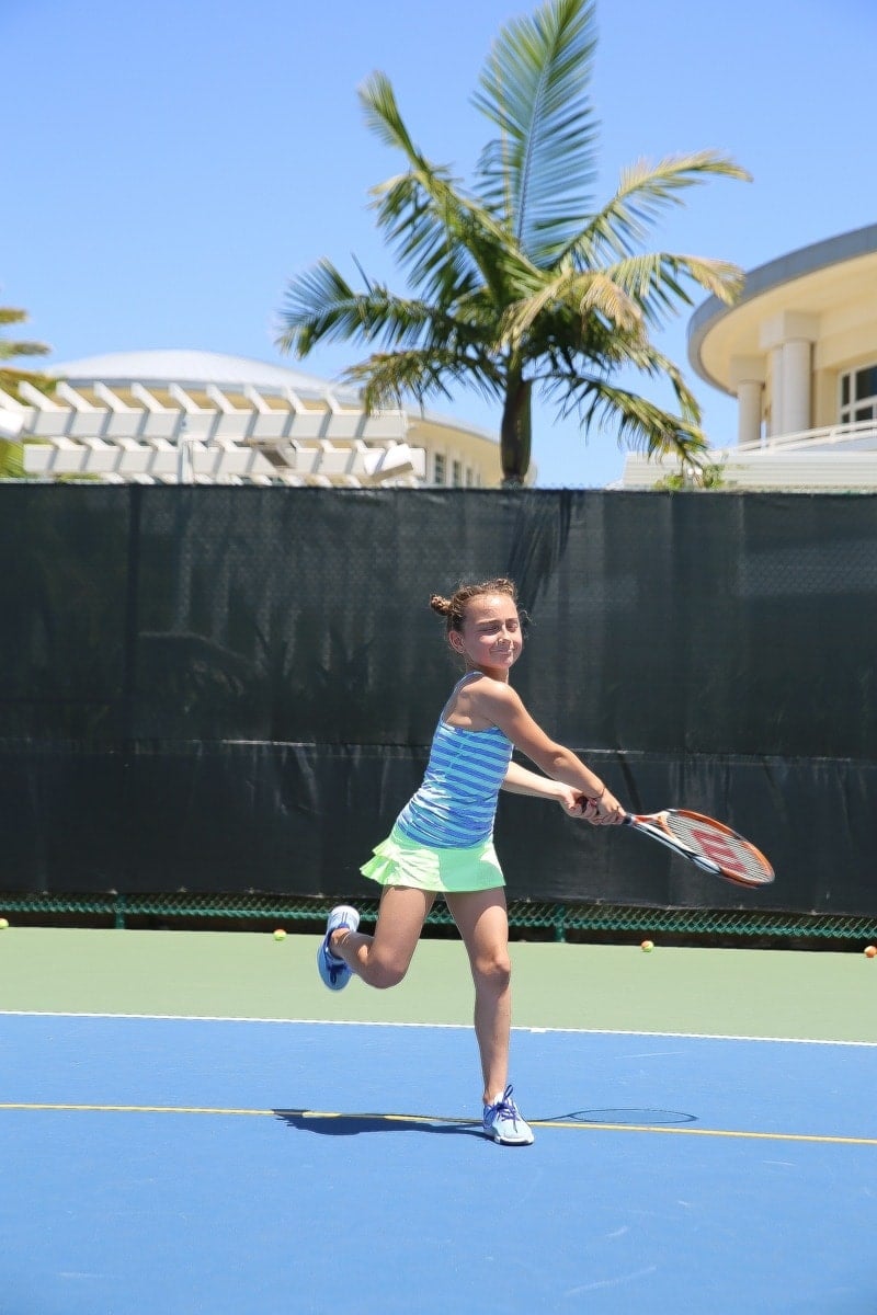 girl playing tennis 