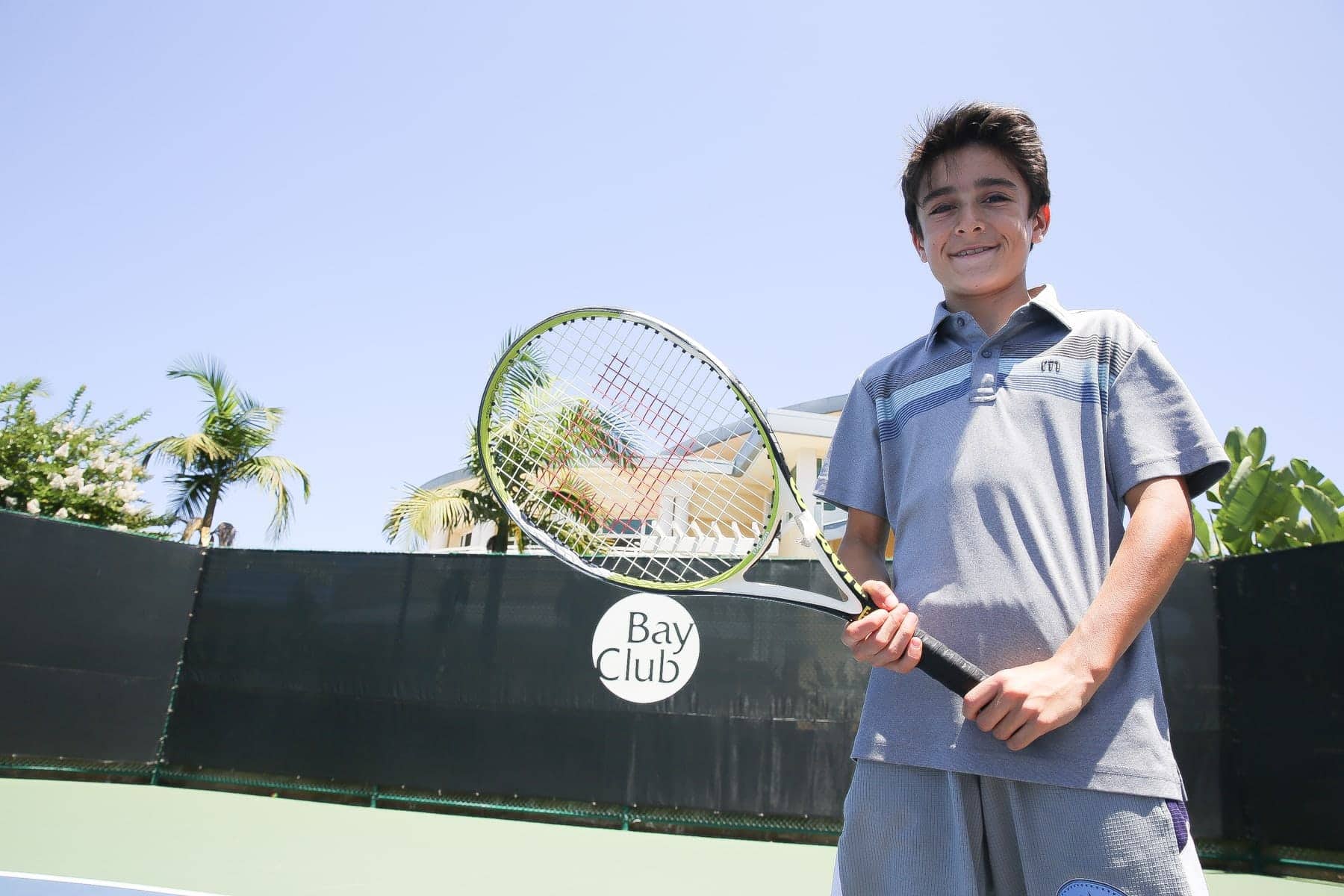 boy playing tennis 