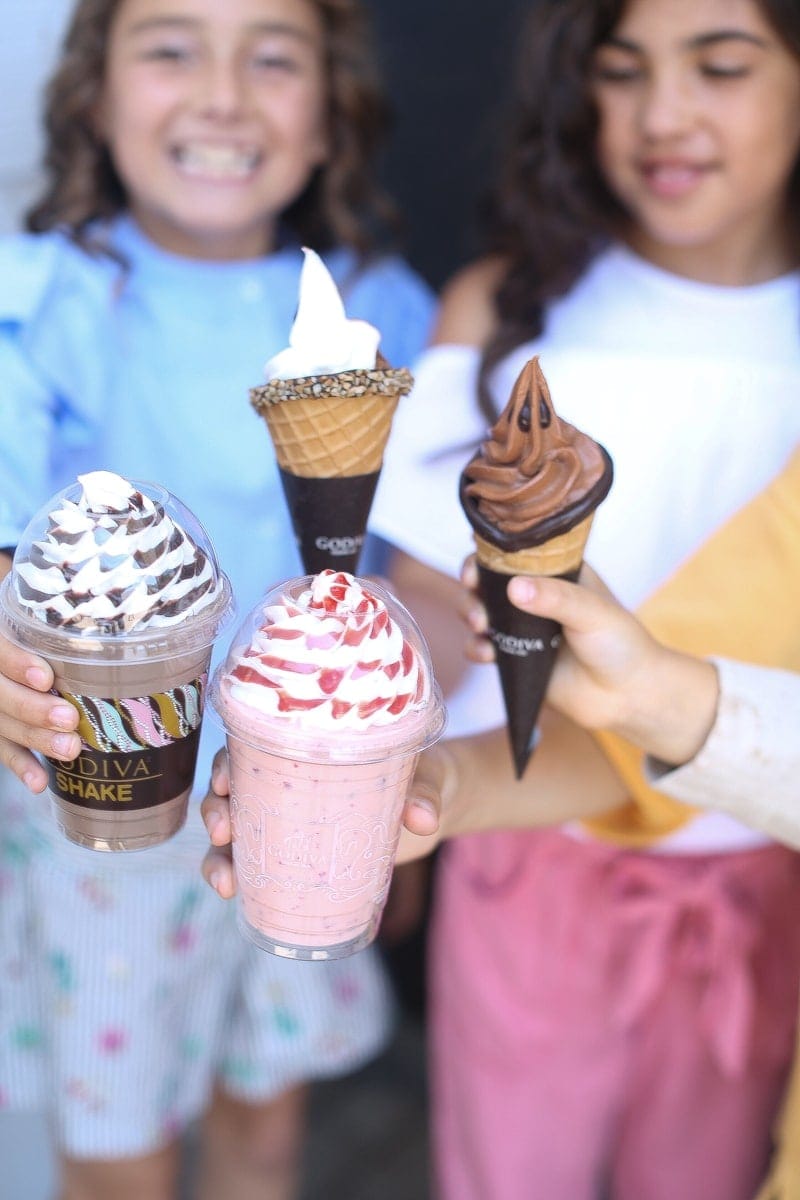 kids holding ice cream cones