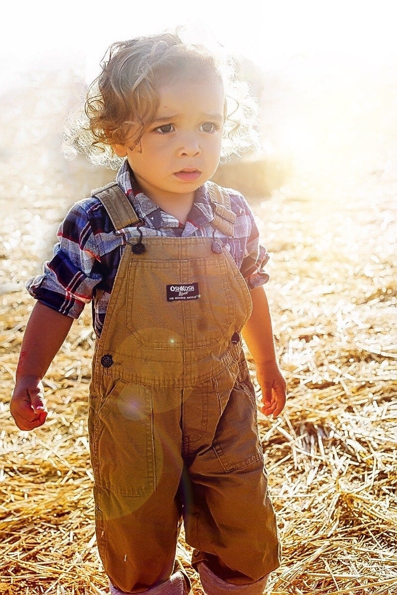 Brody in an adorable plaid shirt and canvas overalls