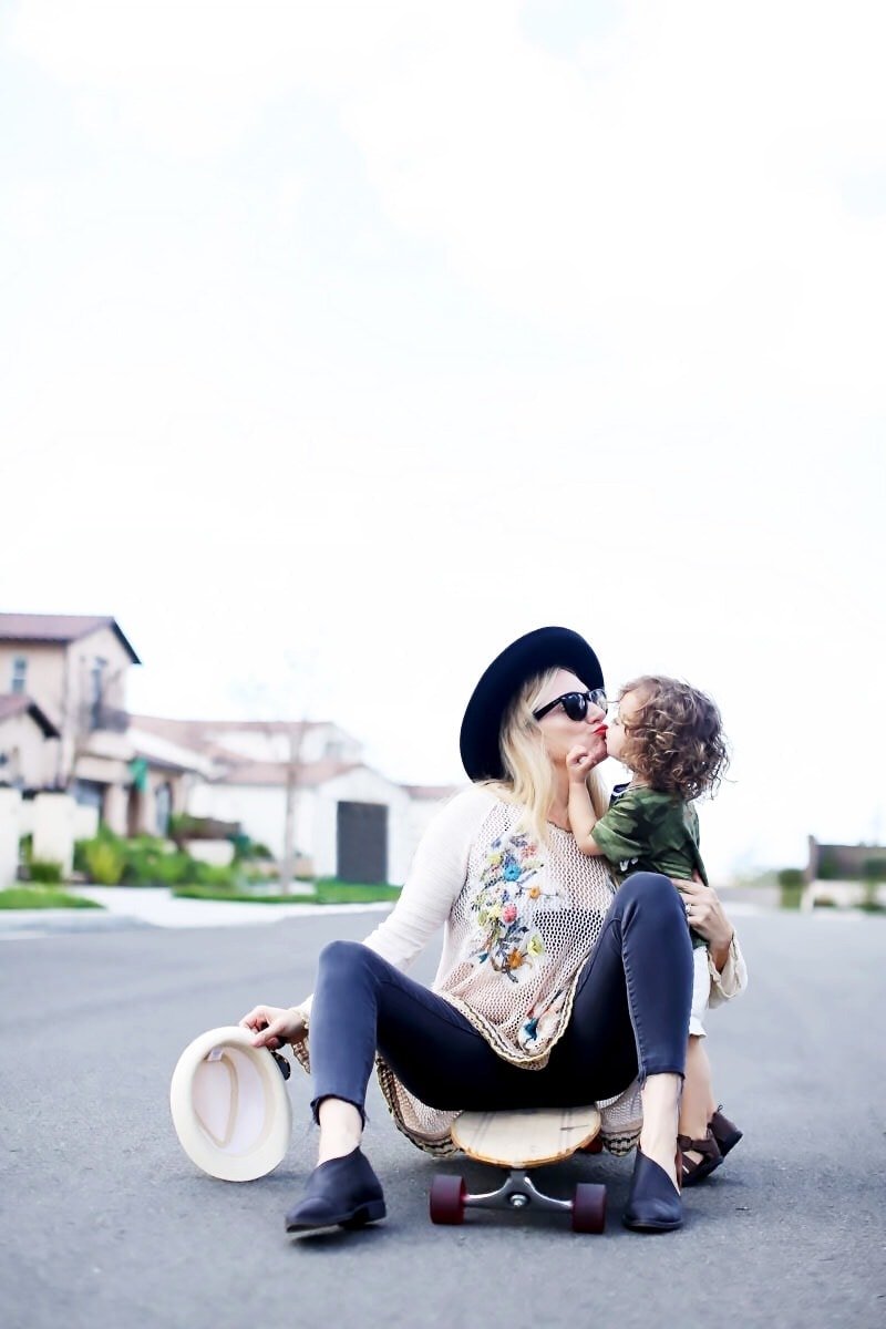 mom kissing toddler