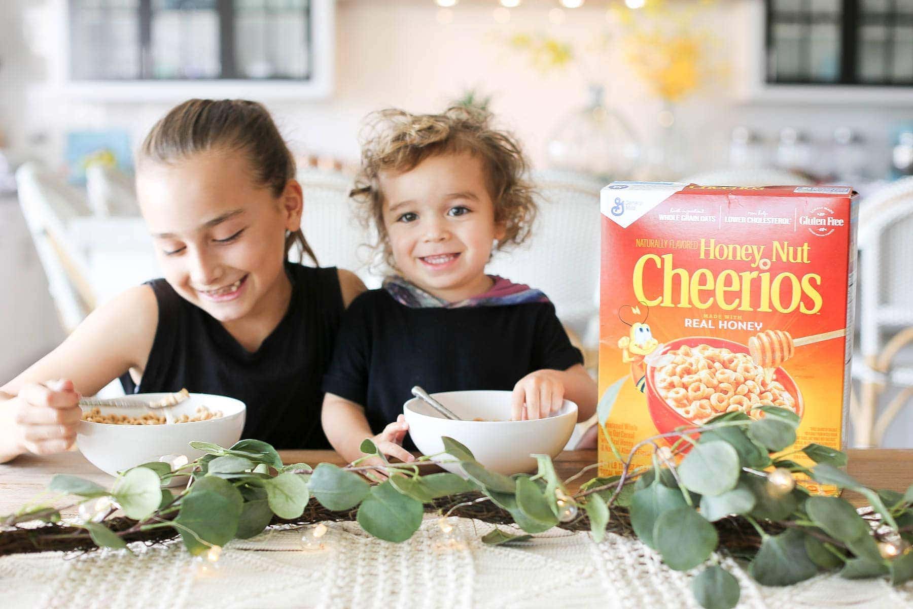 Children enjoying Honey Nut Cheerios for breakfast