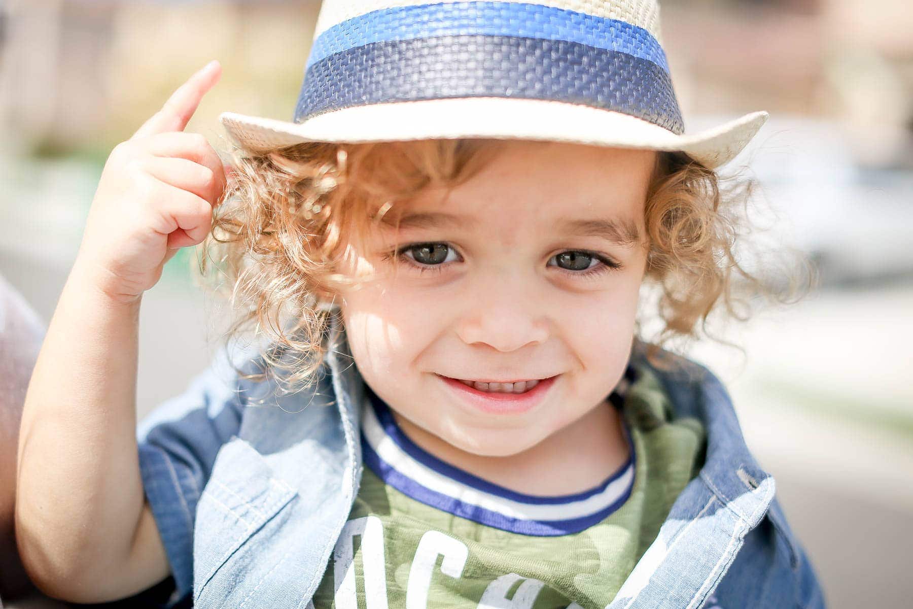 toddler with fashionable hat