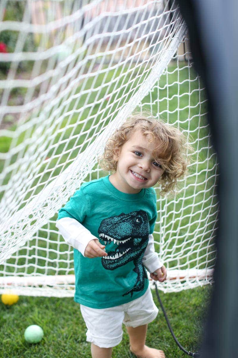 smiling boy playing ball