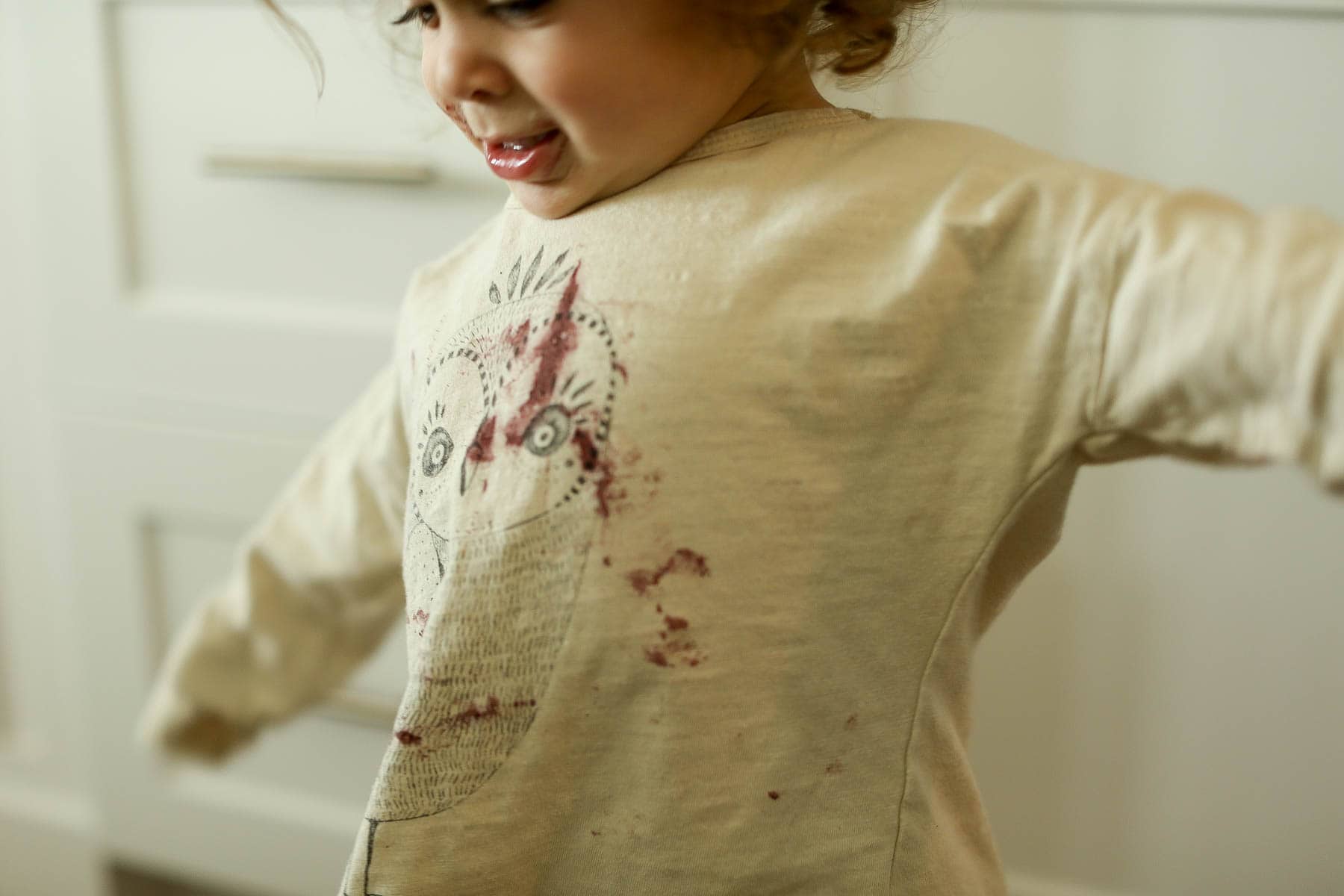 child in dirty shirt