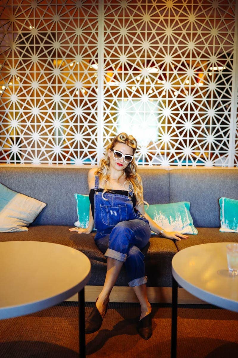 Woman's Photo with a Unique wall design #citygirlgonemom #hyattregency #lajollasandiego #lajolla