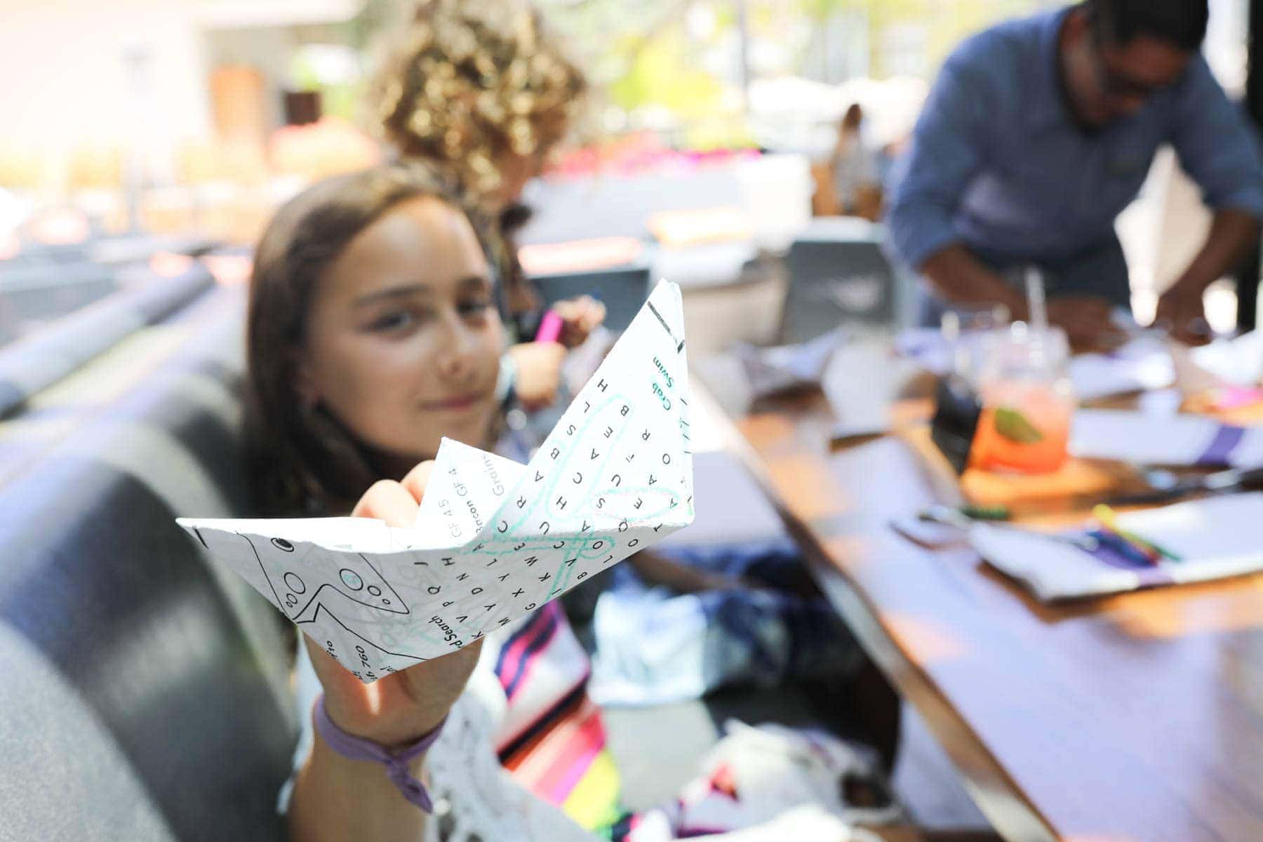 Kid Holding a Paper Boat #familytravelsandiego #sandiego #fourseasonsresidenceclub #bigfamilytravel 