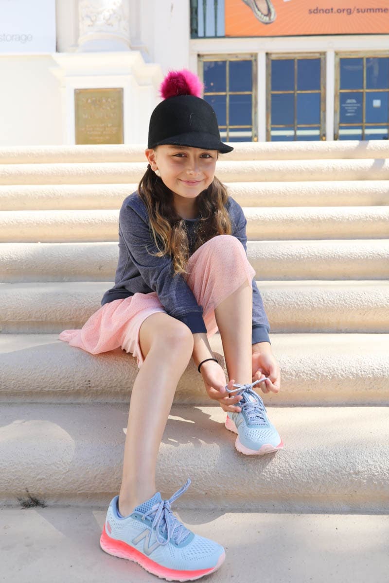 girl on steps in sneakers