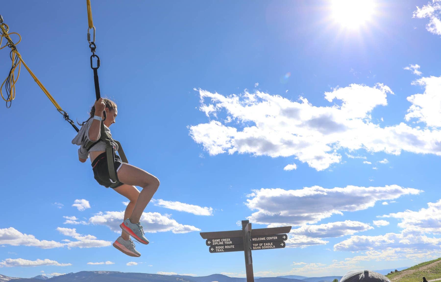 Happy Child Bounces on A Bungee Trampoline