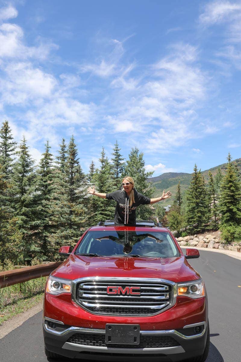 girl in GMC Acadia