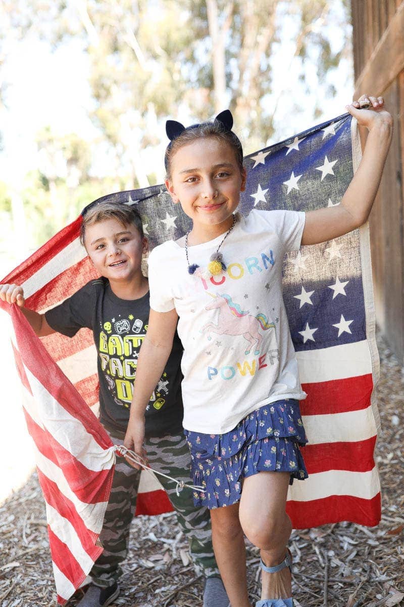 kids with flag back to school