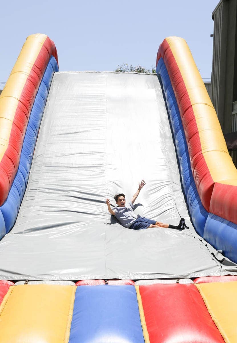 Kid Enjoying the Inflatable Slide at Warner Bros Studios #hollywood #warnerbrothers #teentitansgotothemovies #citygirlgonemom