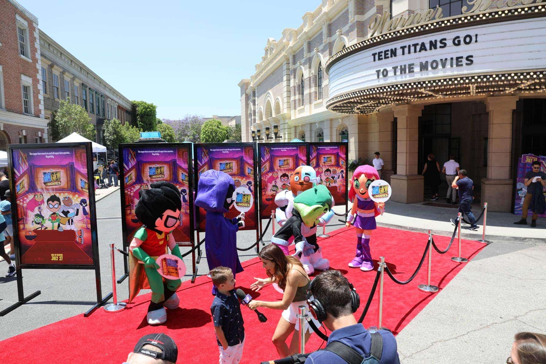 Teen Titans Go To The Movies Mascots Dancing while A lady interviews a kid #hollywood #warnerbrothers #teentitansgotothemovies #citygirlgonemom