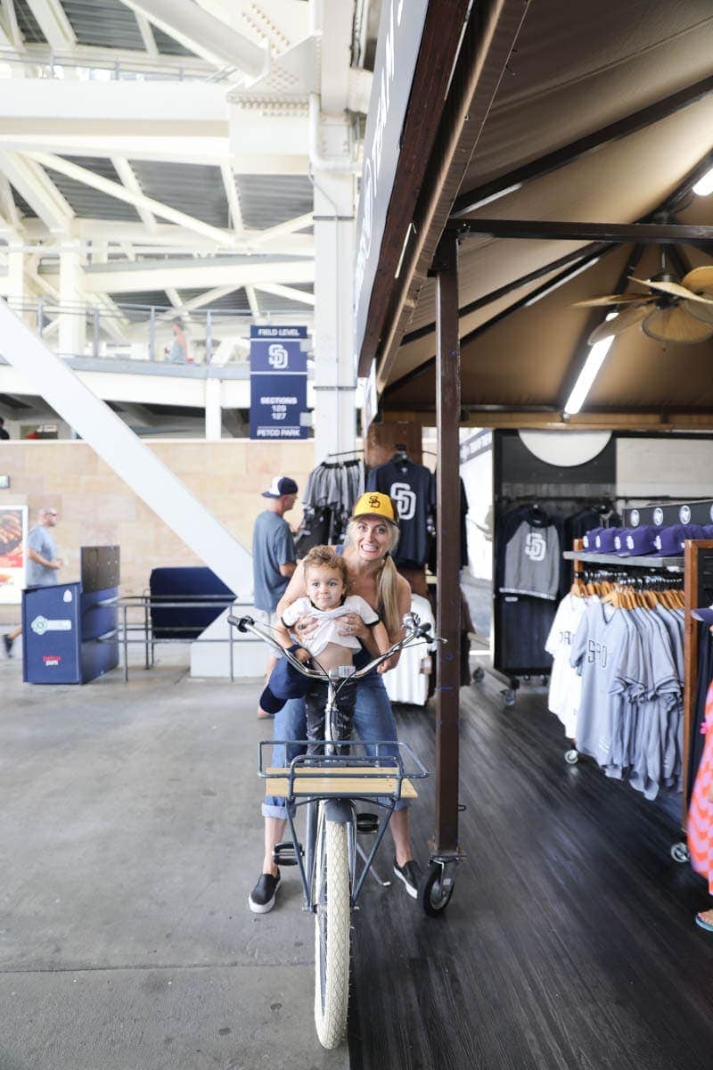 Mom and Child riding a Bike in the Team Store #familyday #weekend #familydaysout #citygirlgonemom #teamstore