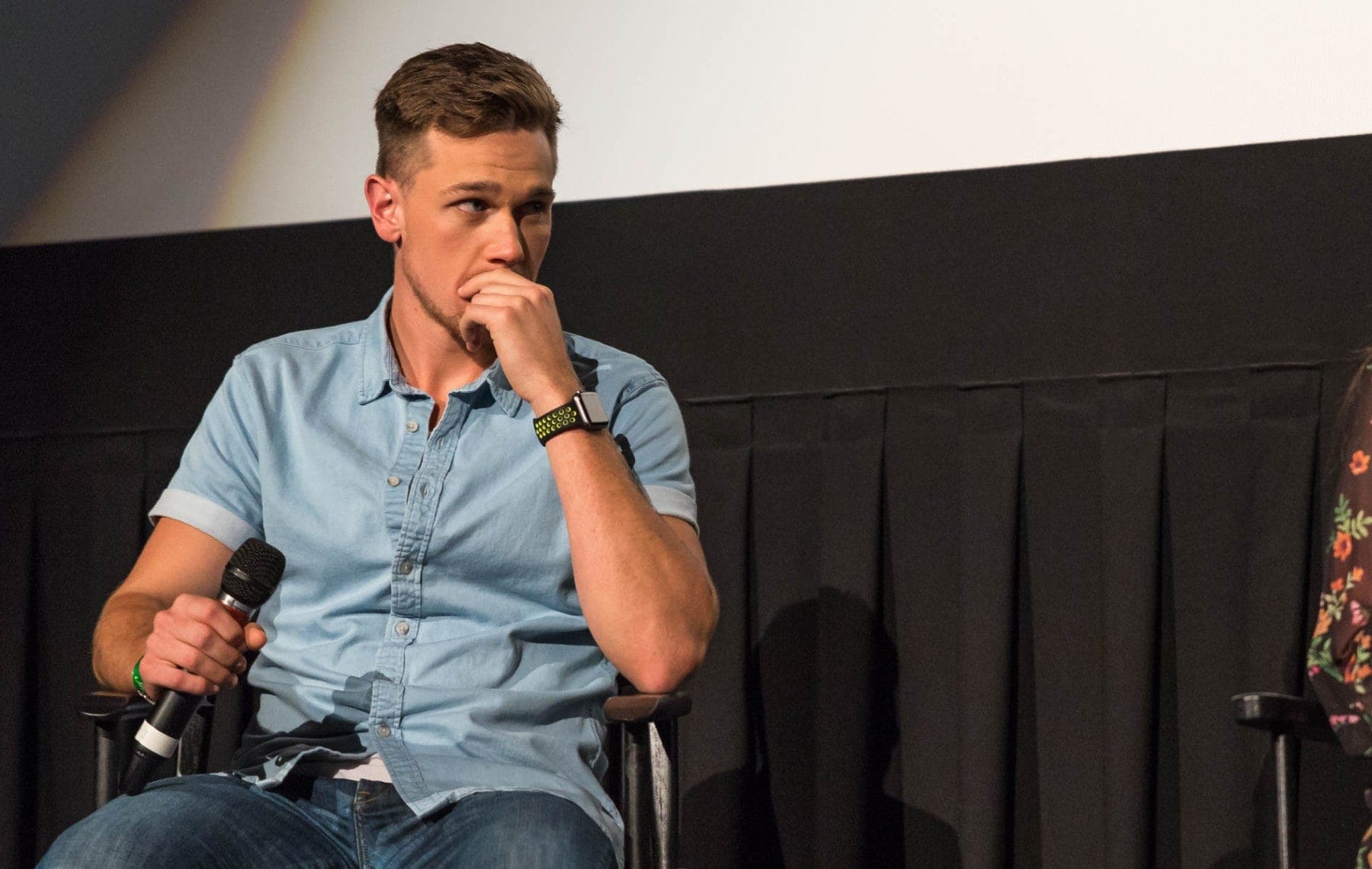 Taylor John Smith Sitting holding a Micrphone #moviescreening #sandiegofilmfestival #hbo #sharpobjects