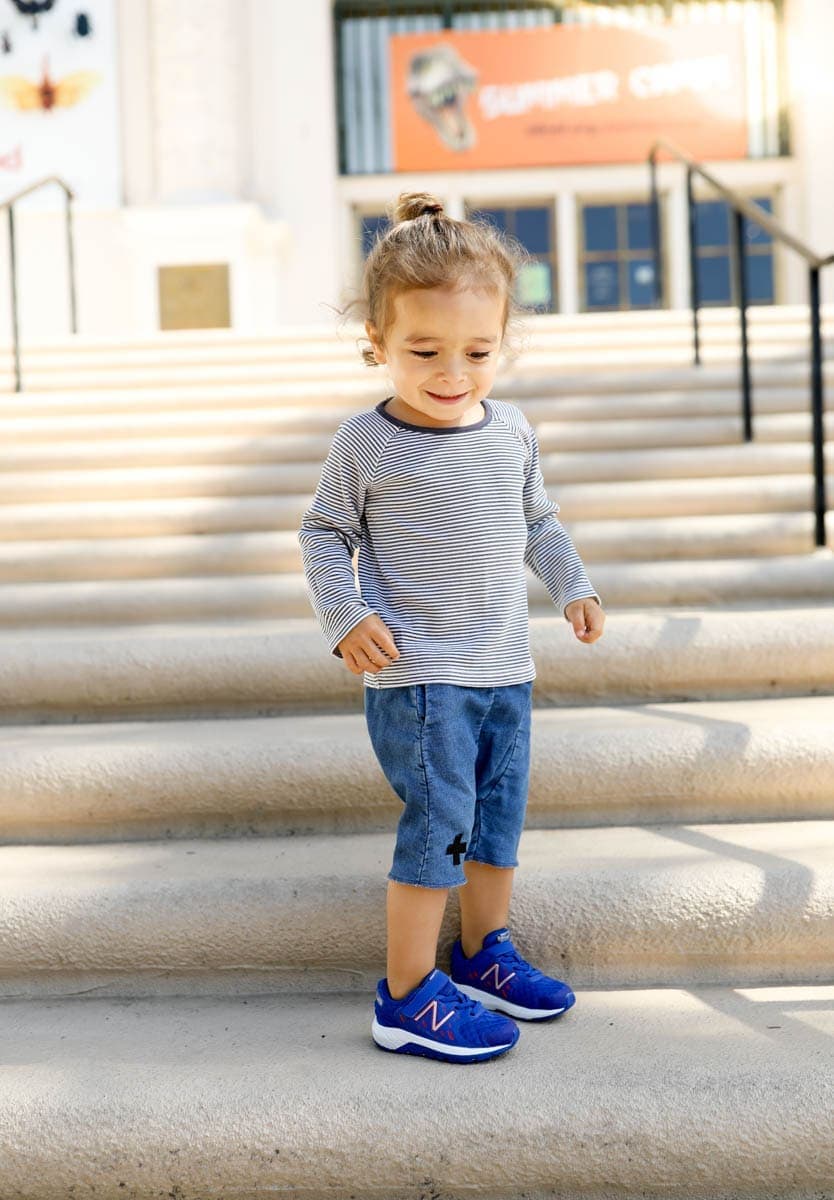 toddler on steps in new balance