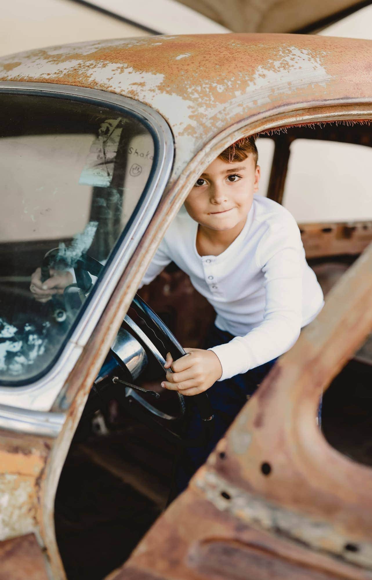 cute boy in vintage car