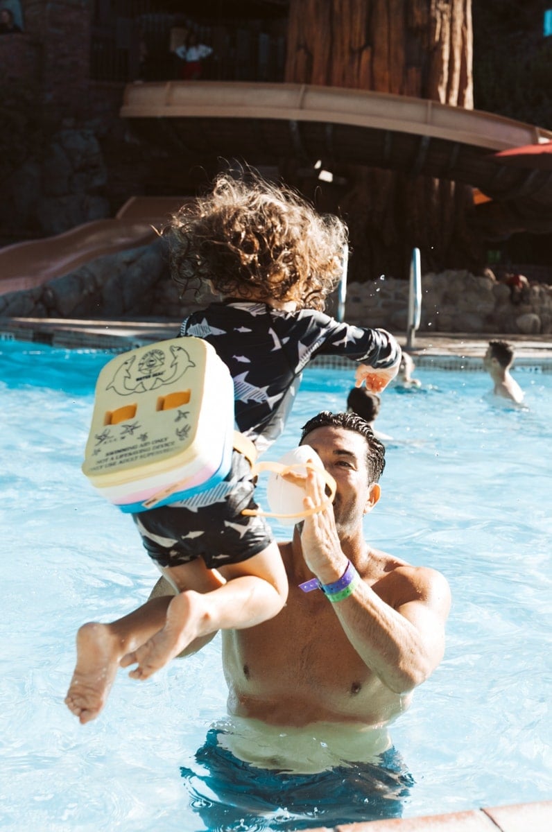 Toddler Jumping In Pool